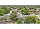 Aerial view of neighborhood featuring the home, mature trees, and surrounding houses at 10139 Carrin Rd, Spring Hill, FL 34608