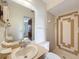 Cozy bathroom featuring a sink with a large mirror and a stand-up shower at 10139 Carrin Rd, Spring Hill, FL 34608