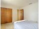 Bedroom featuring neutral walls, neutral carpeting, a wood closet, and a bed at 10139 Carrin Rd, Spring Hill, FL 34608
