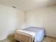 Bedroom featuring neutral walls, carpet floors and a bed with a blanket at 10139 Carrin Rd, Spring Hill, FL 34608