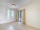 Dining room with tile floor and access to outdoor patio at 10139 Carrin Rd, Spring Hill, FL 34608