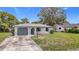 Charming single-story home with a well-maintained front yard and a one car garage at 10139 Carrin Rd, Spring Hill, FL 34608