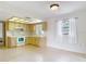 Well-lit kitchen with ample cabinet space and a view to the dining area at 10139 Carrin Rd, Spring Hill, FL 34608