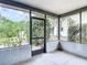 Enclosed lanai with view to the backyard at 10139 Carrin Rd, Spring Hill, FL 34608