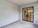 Enclosed lanai with sliding glass door leading to the interior at 10139 Carrin Rd, Spring Hill, FL 34608