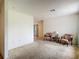 Cozy living room featuring two comfortable armchairs and a small side table at 10139 Carrin Rd, Spring Hill, FL 34608