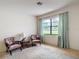 Living room with large window letting in natural light at 10139 Carrin Rd, Spring Hill, FL 34608