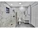 Bathroom features marble tile, a glass-enclosed shower, and modern fixtures at 10277 Rosetti Ct, Spring Hill, FL 34608