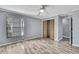Bedroom with wood flooring, ceiling fan, closet, and natural light at 10277 Rosetti Ct, Spring Hill, FL 34608