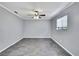 Neutral bedroom with tile floors features a ceiling fan and window with blinds at 10277 Rosetti Ct, Spring Hill, FL 34608