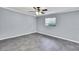 Neutral bedroom with tile floors features a ceiling fan and window with blinds at 10277 Rosetti Ct, Spring Hill, FL 34608