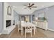 Elegant dining room featuring a fireplace, modern decor, and stylish furniture at 10277 Rosetti Ct, Spring Hill, FL 34608