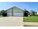 Charming single-story home featuring a two-car garage and a well-manicured lawn at 10277 Rosetti Ct, Spring Hill, FL 34608