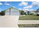 Charming single-story home features a well-maintained lawn, two-car garage, and inviting front entrance at 10277 Rosetti Ct, Spring Hill, FL 34608