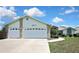 Spacious two-car garage with brick accents, offering ample parking and storage space for homeowners at 10277 Rosetti Ct, Spring Hill, FL 34608