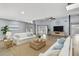 Bright and airy living room featuring vaulted ceilings, skylights, and stylish furnishings at 10277 Rosetti Ct, Spring Hill, FL 34608