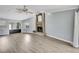 Bright living room featuring a fireplace, wet bar, and hardwood floors at 10277 Rosetti Ct, Spring Hill, FL 34608
