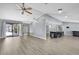 Open floor plan flows from the living room to the kitchen and outdoor living space at 10277 Rosetti Ct, Spring Hill, FL 34608
