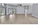 Bright, spacious living area with modern floors, ceiling fan, access to the pool at 10277 Rosetti Ct, Spring Hill, FL 34608