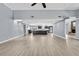Spacious open-concept living area with modern floors, kitchen access, and great flow at 10277 Rosetti Ct, Spring Hill, FL 34608
