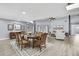 Open-concept living and dining area with abundant natural light and stylish decor at 10277 Rosetti Ct, Spring Hill, FL 34608