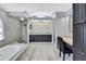 Well-appointed main bathroom with a soaking tub, walk-in shower, and dual vanities at 10277 Rosetti Ct, Spring Hill, FL 34608
