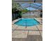 Private pool area featuring a refreshing in-ground pool and ample lounging space at 10277 Rosetti Ct, Spring Hill, FL 34608