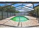Relaxing screened-in pool area with brick pavers, creating an ideal outdoor entertaining space at 10277 Rosetti Ct, Spring Hill, FL 34608
