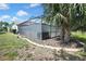 Enclosed pool area surrounded by tropical landscaping, providing privacy and shade for relaxation by the water at 10277 Rosetti Ct, Spring Hill, FL 34608