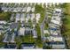 Overhead shot of a lovely home in a peaceful neighborhood, featuring well-kept lawns and tree-lined streets at 1084 Vista Fina Ct, Spring Hill, FL 34608