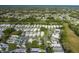 Bird's eye view of a delightful home in a serene community, showcasing neatly arranged properties and verdant spaces at 1084 Vista Fina Ct, Spring Hill, FL 34608