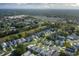 Expansive aerial view of a beautiful home nestled in a vibrant community with lush greenery and manicured lawns at 1084 Vista Fina Ct, Spring Hill, FL 34608