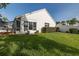 View of the backyard with lush green grass and manicured landscaping, great for outdoor activities at 1084 Vista Fina Ct, Spring Hill, FL 34608