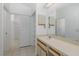 This bathroom features a sink and mirror with a large walk in closet at 1084 Vista Fina Ct, Spring Hill, FL 34608