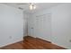 Bedroom featuring hardwood floors, closet, and bright natural light at 1084 Vista Fina Ct, Spring Hill, FL 34608