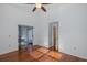 This is a bedroom with wood floors and access to a sun room at 1084 Vista Fina Ct, Spring Hill, FL 34608
