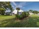 The home showcases its manicured lawn and landscaping, which creates an inviting and well-maintained exterior at 1084 Vista Fina Ct, Spring Hill, FL 34608