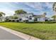 Beautiful single-Gathering home featuring manicured landscaping, a two-car garage, and a charming gated entrance at 1084 Vista Fina Ct, Spring Hill, FL 34608