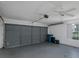 The garage features a ceiling fan, a window, and ample space for parking and storage solutions at 1084 Vista Fina Ct, Spring Hill, FL 34608