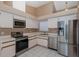 Bright kitchen featuring stainless steel appliances and ample counter space at 1084 Vista Fina Ct, Spring Hill, FL 34608
