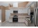 Functional kitchen with white cabinets and stainless steel appliances perfect for cooking and meal preparation at 1084 Vista Fina Ct, Spring Hill, FL 34608