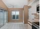 Bright breakfast nook with sliding glass doors to the lanai and tile flooring at 1084 Vista Fina Ct, Spring Hill, FL 34608