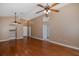 Large living room with hardwood floors, ceiling fans and access to other areas of the home for easy living at 1084 Vista Fina Ct, Spring Hill, FL 34608