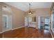 Spacious living room with hardwood floors, ceiling fan, wet bar and easy access to other rooms in the home at 1084 Vista Fina Ct, Spring Hill, FL 34608
