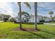 A bright single-Gathering home featuring manicured landscaping, and a two-car garage at 1084 Vista Fina Ct, Spring Hill, FL 34608