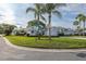 A bright single-Gathering home on a corner lot featuring manicured landscaping, and a two-car garage at 1084 Vista Fina Ct, Spring Hill, FL 34608