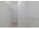 This walk-in closet has multiple wire shelves for ample storage at 1084 Vista Fina Ct, Spring Hill, FL 34608