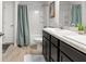 Modern bathroom features a shower, bathtub, and a sleek vanity with countertop space at 11042 Heth Ct, Weeki Wachee, FL 34613