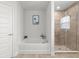 Relaxing bathroom features a soaking tub, a glass shower, and stylish design at 11042 Heth Ct, Weeki Wachee, FL 34613