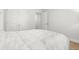 Cozy bedroom showcases a comfortable bed and views to adjacent rooms via doors at 11042 Heth Ct, Weeki Wachee, FL 34613